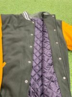 green and mustard varsity jacket